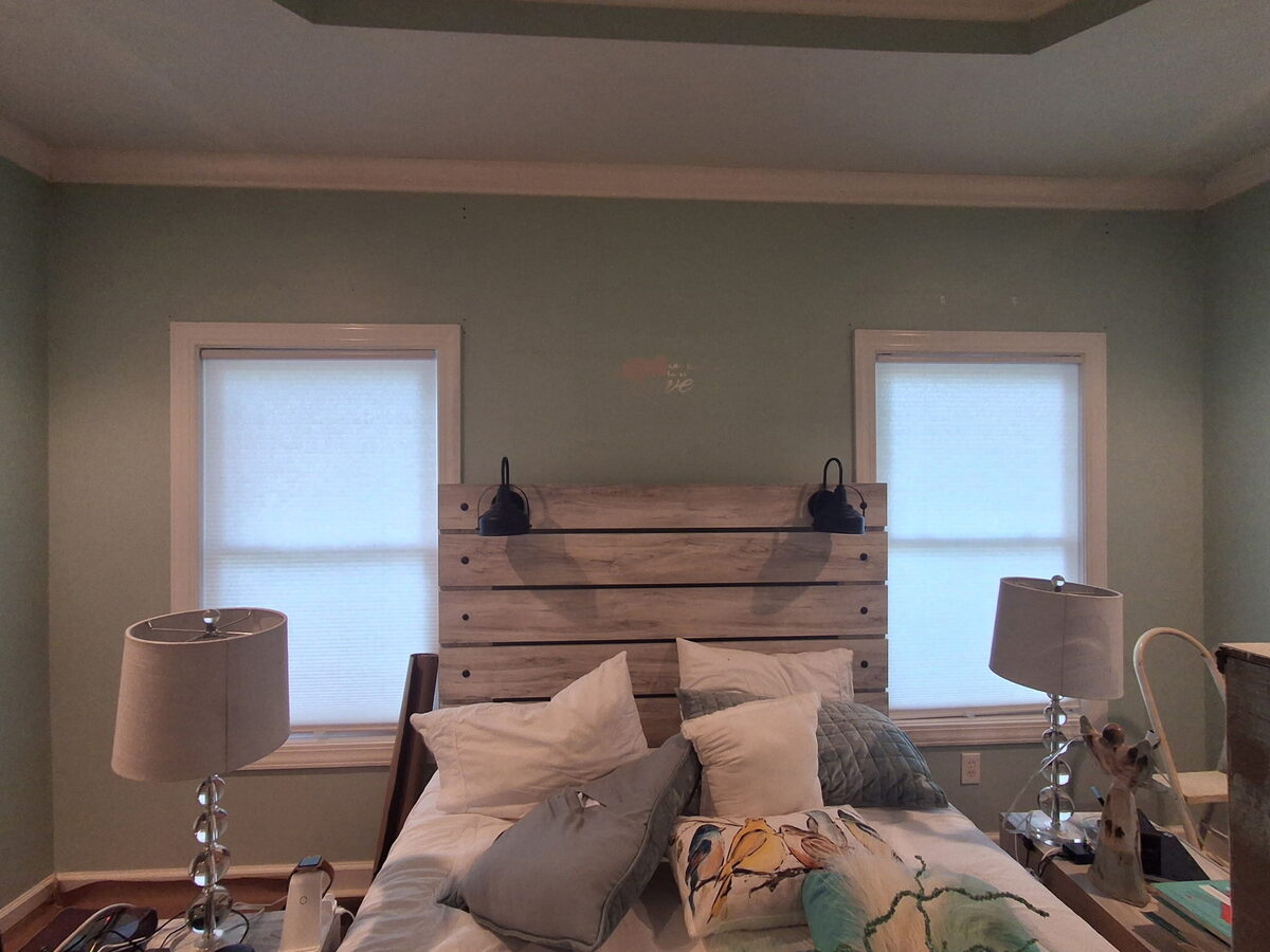 Master bedroom before remodel with the original wall color