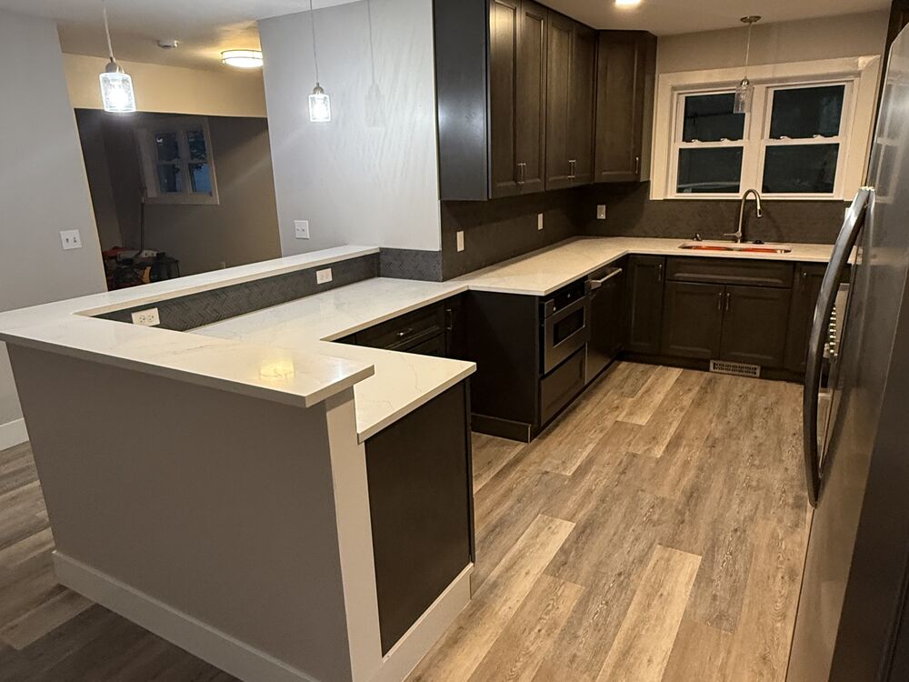 Kitchen remodel with quartz countertops and breakfast bar