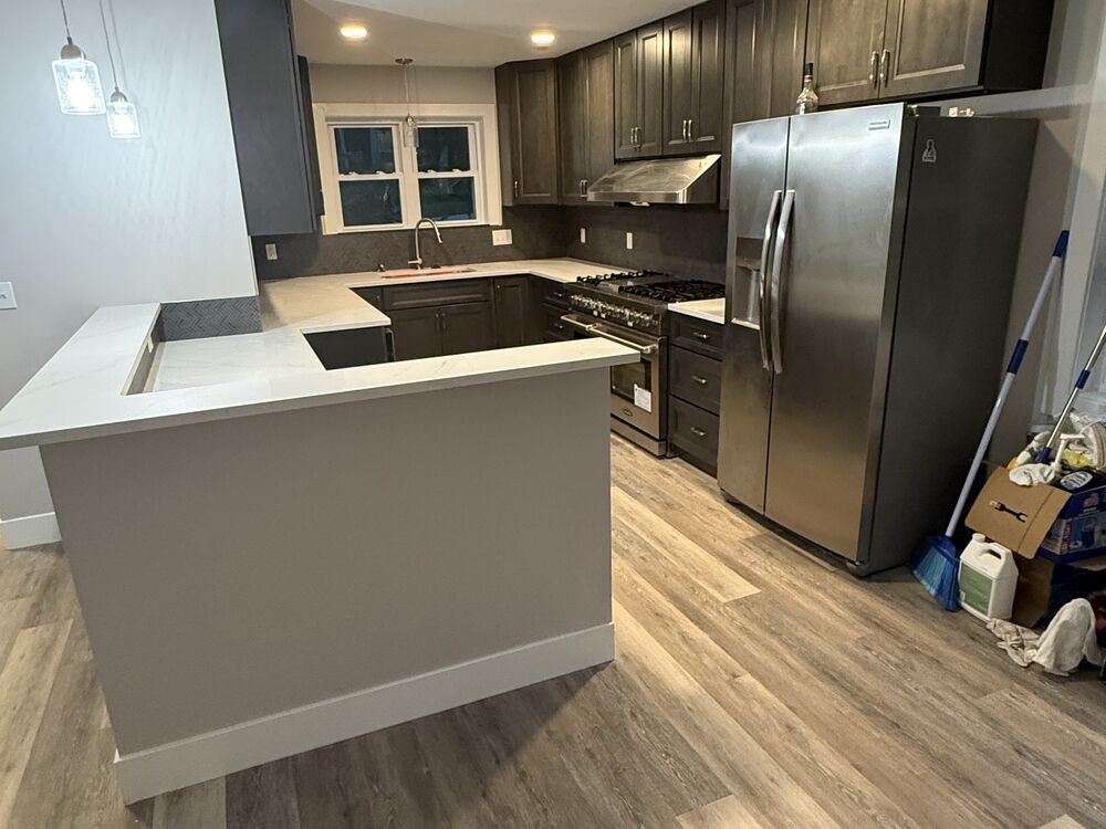Kitchen remodel with new stainless appliances and gas range