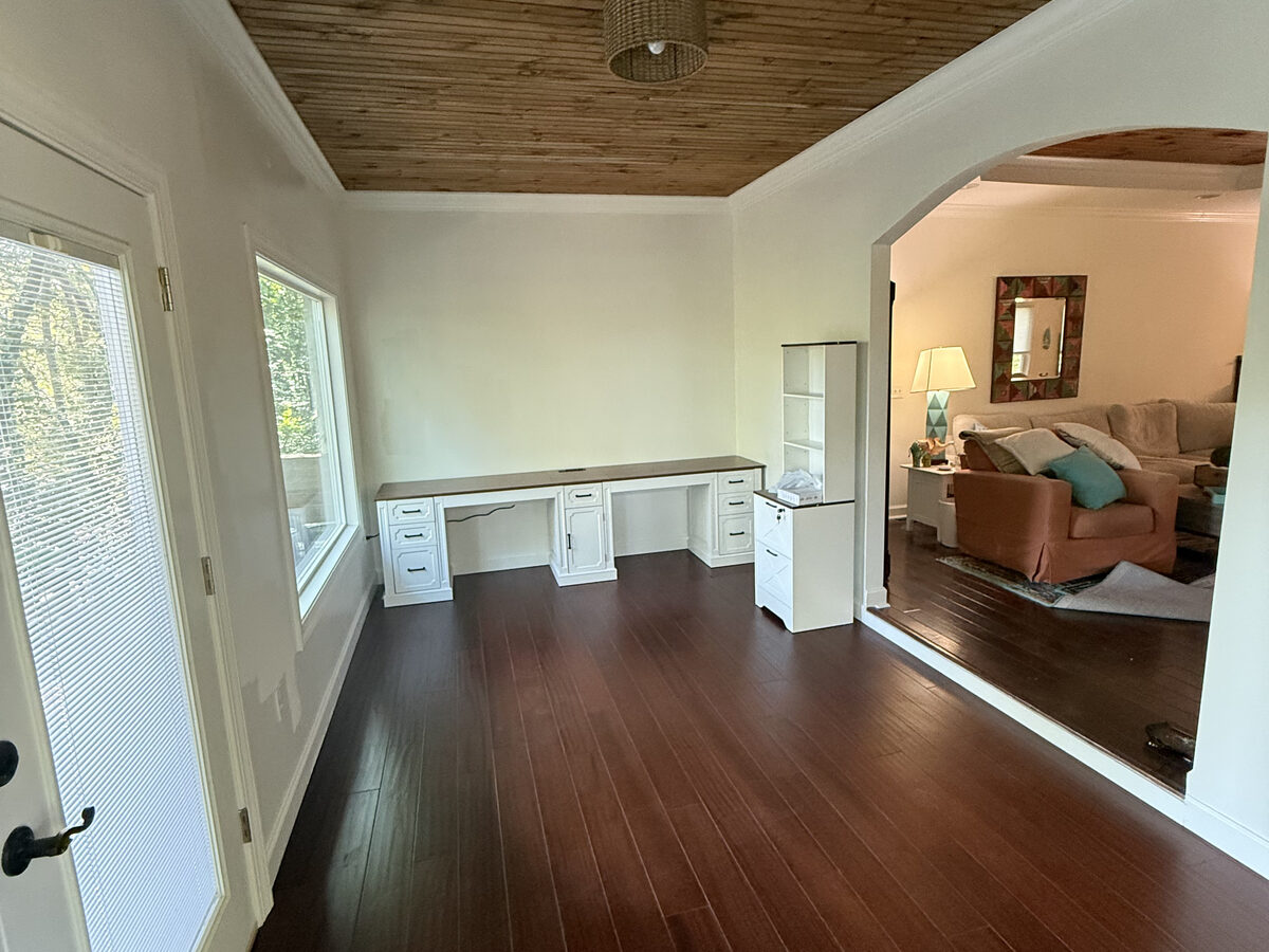 Living room after remodel with new dark hardwood floors and fresh paint
